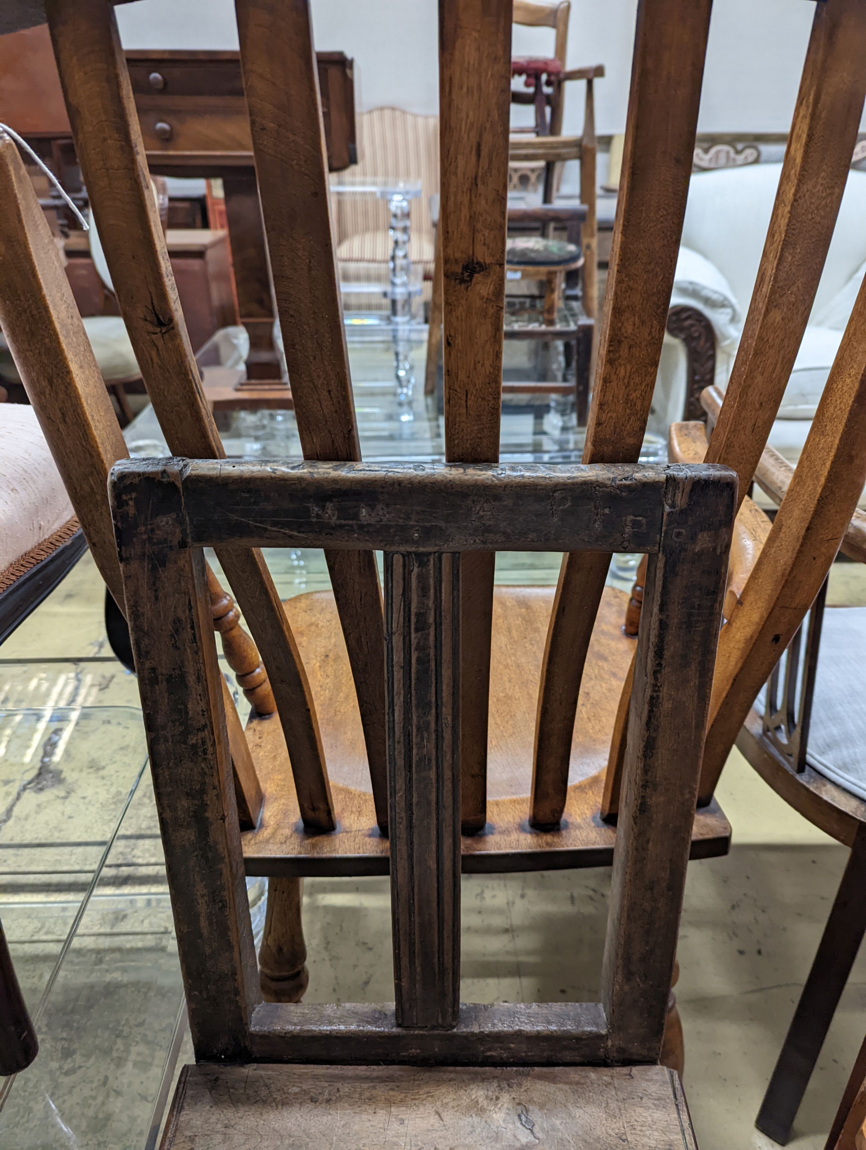 Two antique walnut or pine backstools.